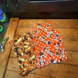 LuLaRoe women’s Leggings - Orange and Black Disney Print